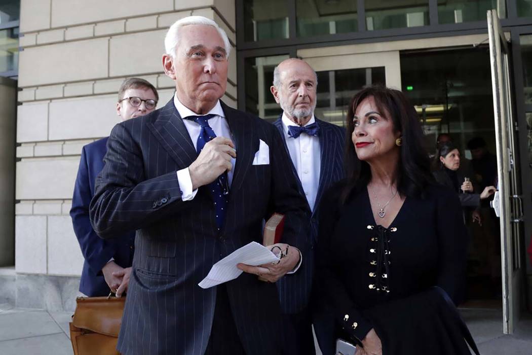 Roger Stone, left, with his wife Nydia Stone, leaves federal court in Washington, Friday, Nov. ...