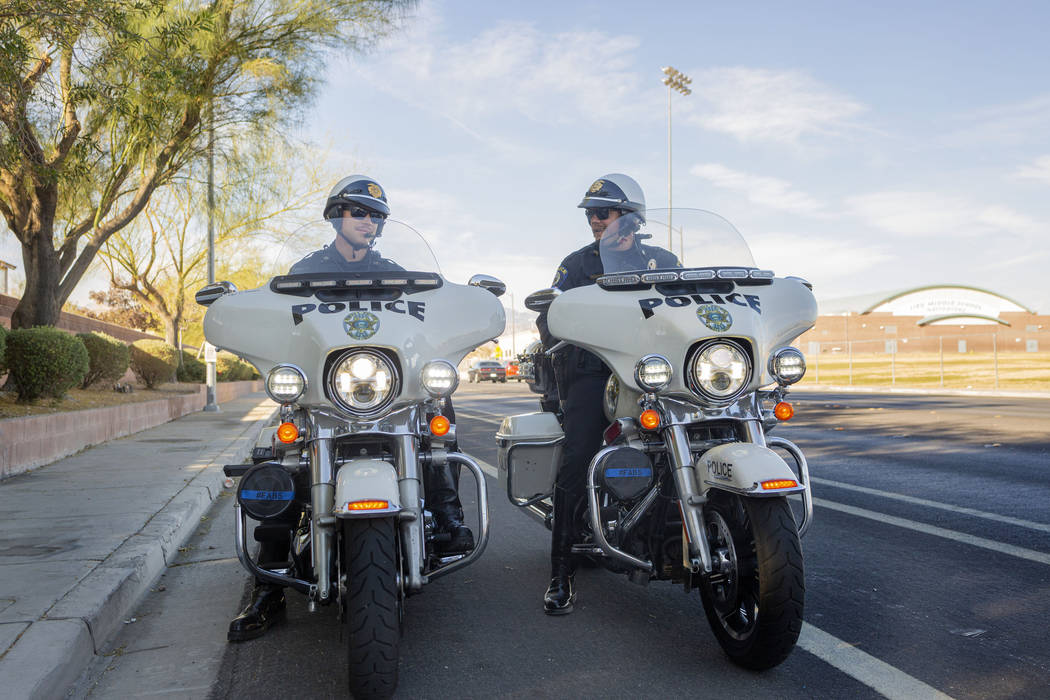 Officers Chris Lourenco, left, and Chris Deuel, from "Fab Five, "the five-member traf ...