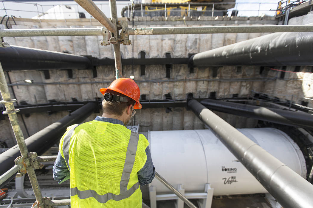 Media get a first glimpse at a tunnel boring machine at the future location of one of the under ...