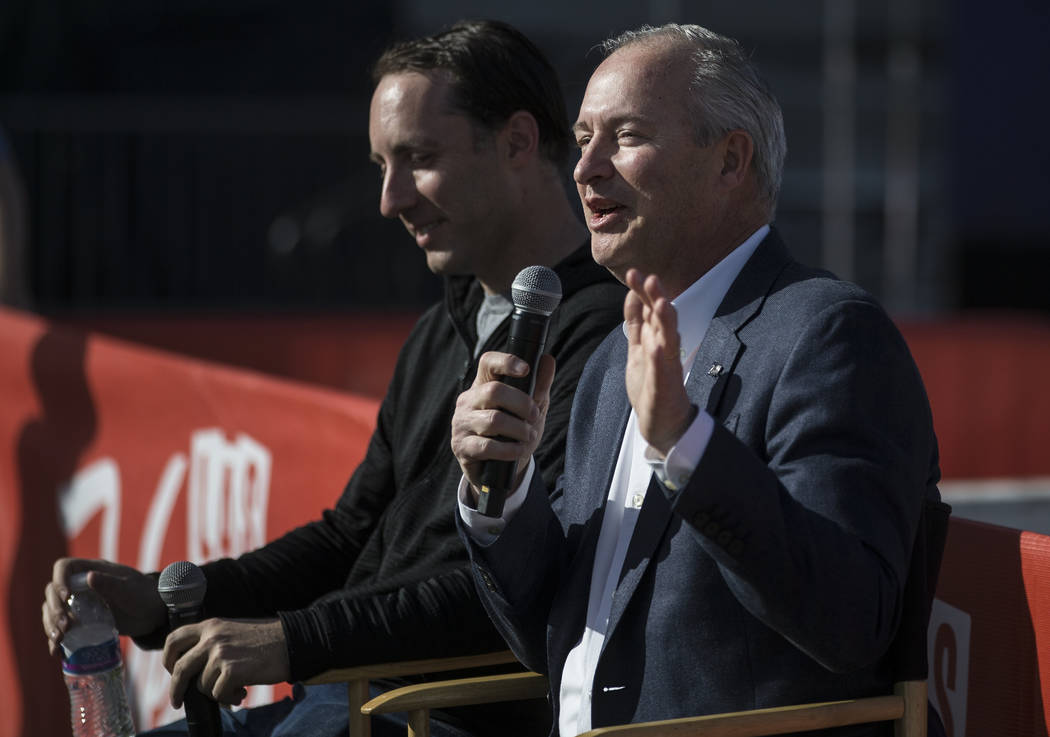 Steve Hill, right, Chief Executive Officer of the Las Vegas Convention and Visitors Authority, ...