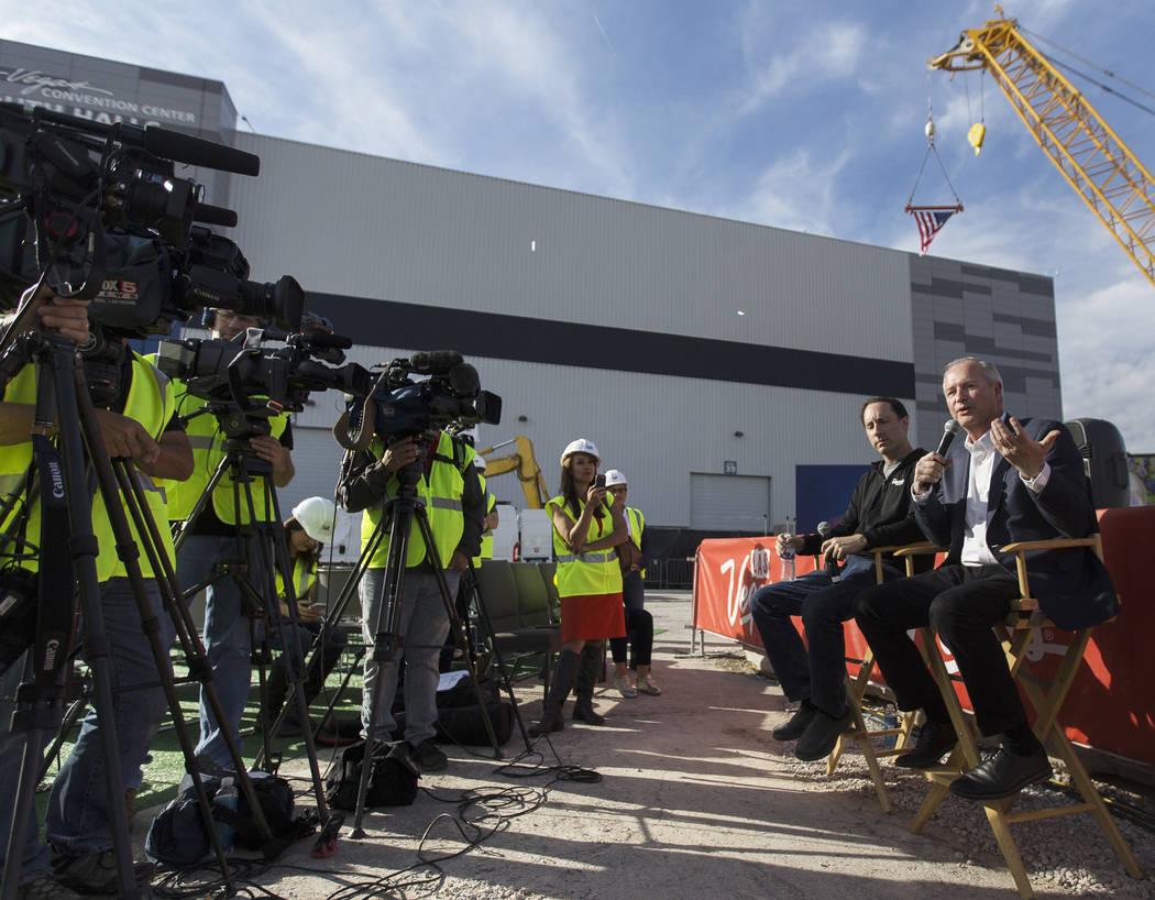 Steve Hill, right, Chief Executive Officer of the Las Vegas Convention and Visitors Authority, ...