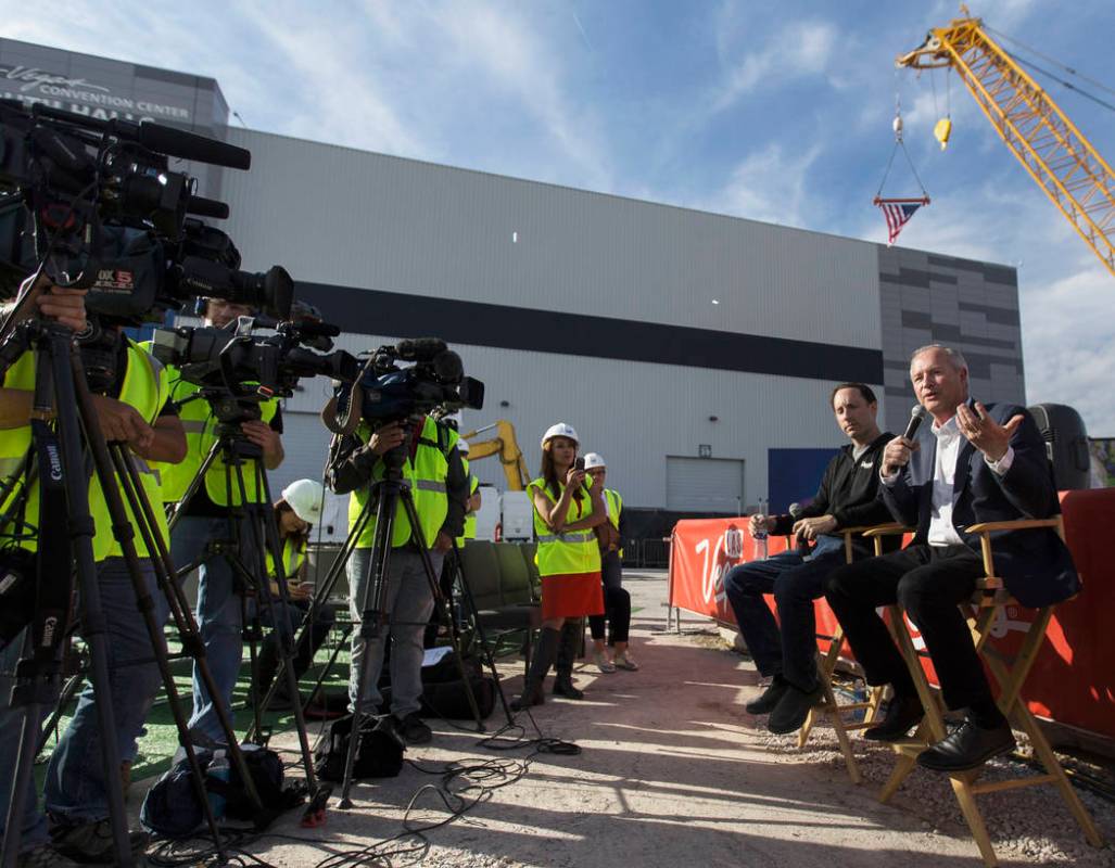 Steve Hill, right, Chief Executive Officer of the Las Vegas Convention and Visitors Authority, ...