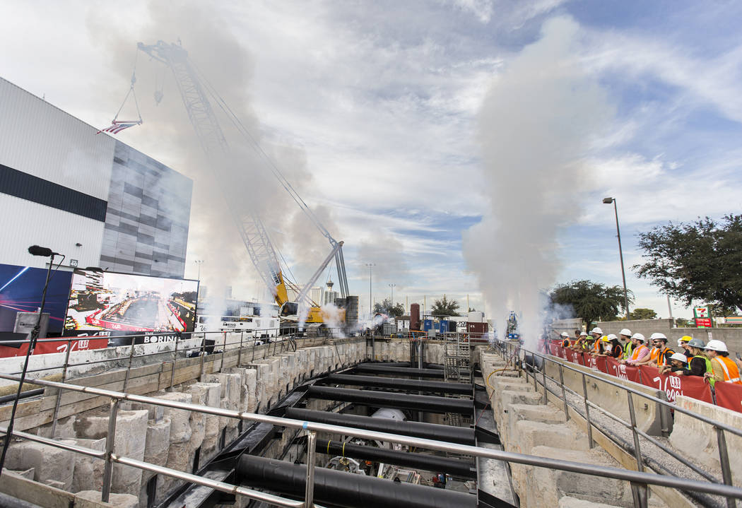 The tunnel boring machine begins work at the future location of one of the underground people m ...