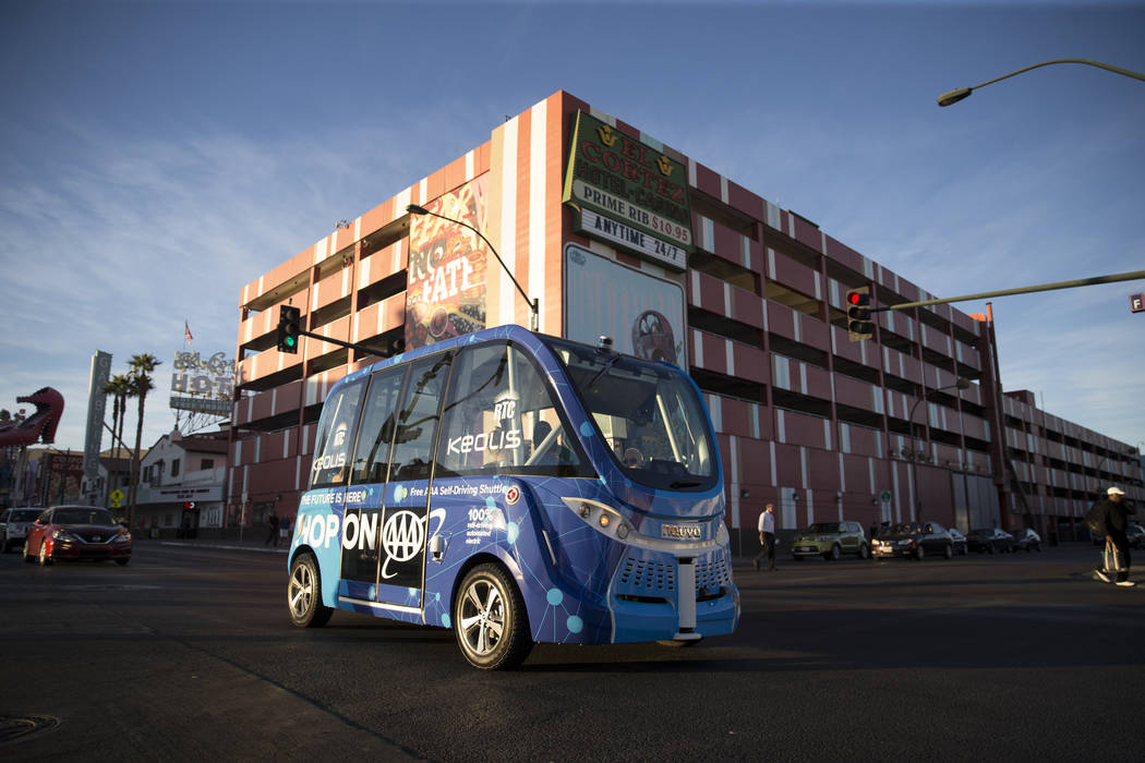 A self-driving vehicle tours people in downtown Las Vegas near the Container Park, Thursday, No ...