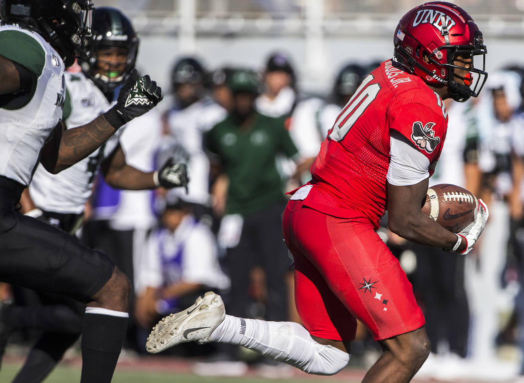 UNLV Rebels wide receiver Darren Woods Jr. (10) makes a catch and run for a touchdown past Hawa ...