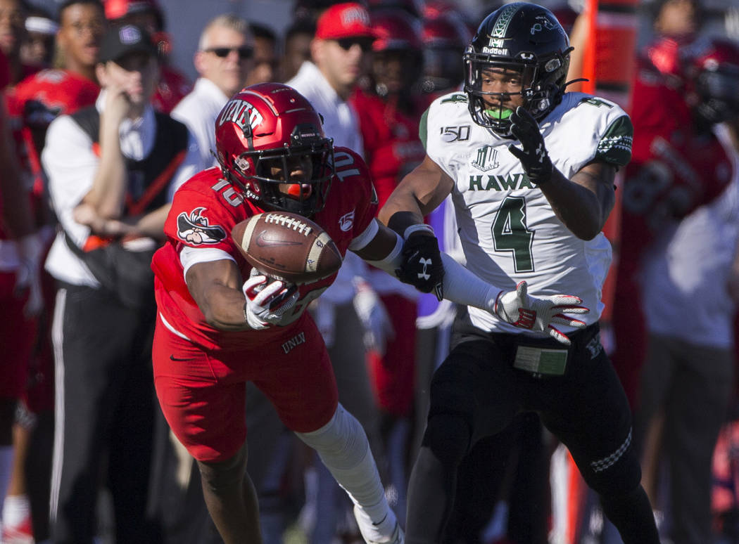 UNLV Rebels wide receiver Darren Woods Jr. (10) lays out to try and make a catch with Hawaii Wa ...