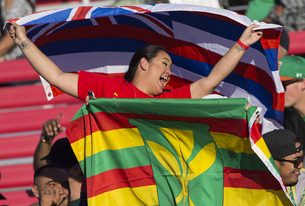 Hawaii fans cheer for the Warriors during their NCAA football game with UNLV on Saturday, Nov. ...