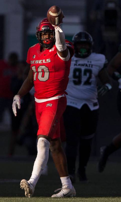 UNLV Rebels wide receiver Darren Woods Jr. (10) signals a first down in front of Hawaii Warrior ...