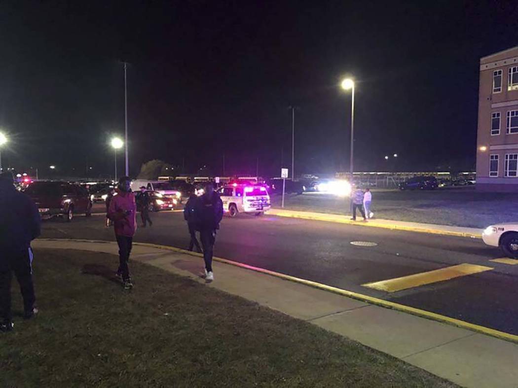 Game attendees leave after shots rang out Friday, Nov. 15, 2019, at a Pleasantville-Camden high ...