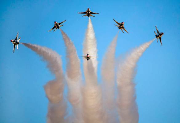All six U.S. Air Force Thunderbirds break away from formation in various directions during the ...