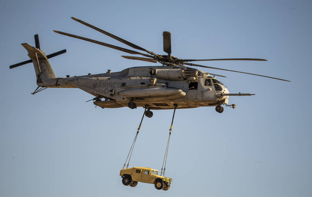 A Marine Corps CH-53 Super Stallion transports a Humvee during the Aviation Nation at Nellis Ai ...