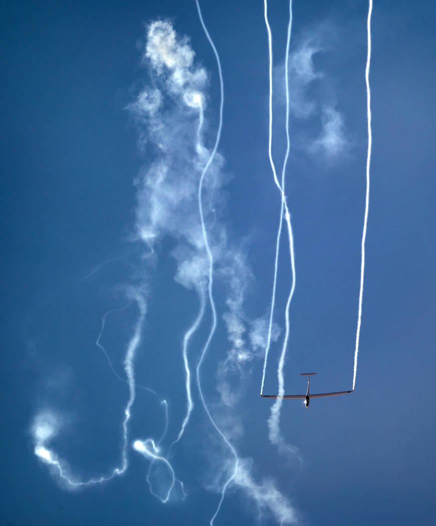 A plane with the U.S. Air Force Academy Glider Team winds its way down during the Aviation Nati ...