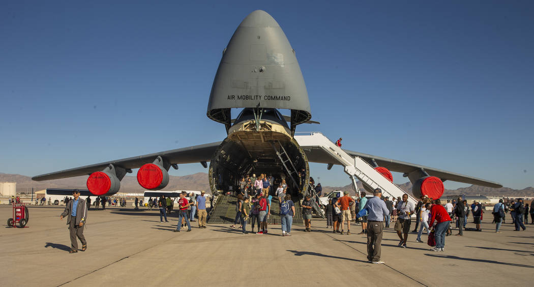 Attendees check out the Lockheed C-5 Galaxy during Aviation Nation at Nellis Air Force Base on ...