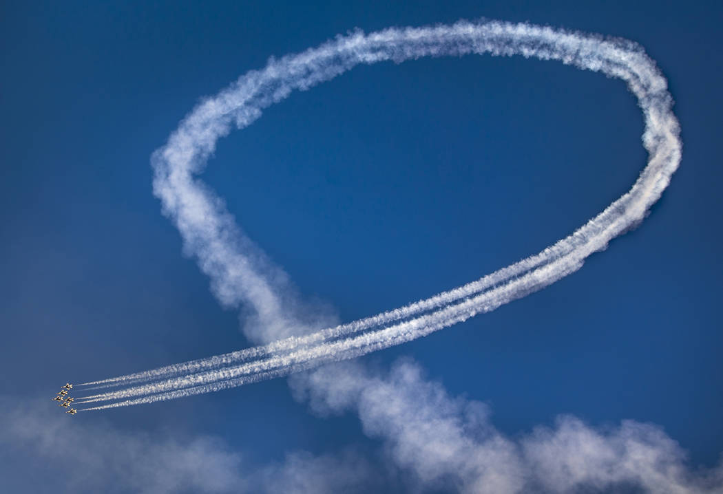 All six U.S. Air Force Thunderbirds stay in formation while completing a loop during the Aviati ...