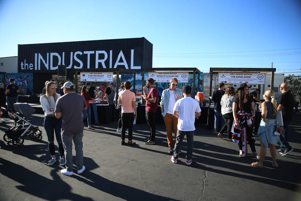 People attend the Las Vegas Pizza Festival at The Industrial Event Space in Las Vegas, Saturday ...