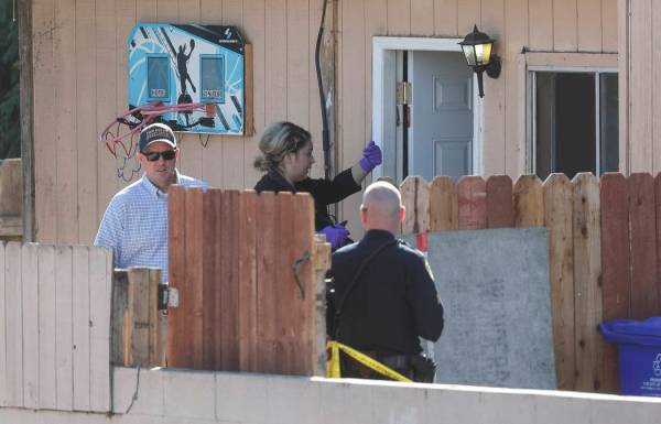 San Diego Police investigate the home where two adults and three children died from gunshot wou ...