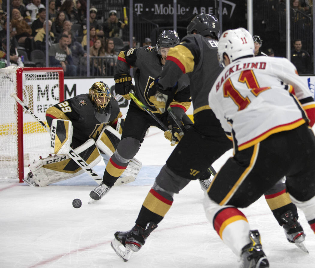 Golden Knights goaltender Marc-Andre Fleury (29) looks to block a shot against the Calgary Flam ...