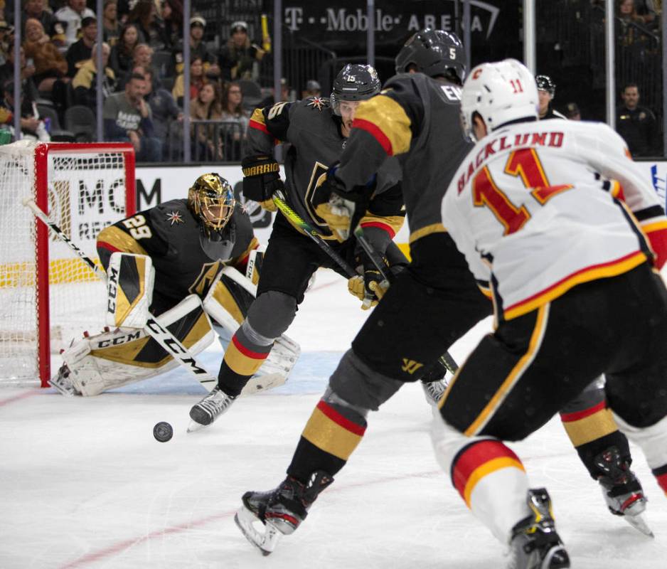 Golden Knights goaltender Marc-Andre Fleury (29) looks to block a shot against the Calgary Flam ...