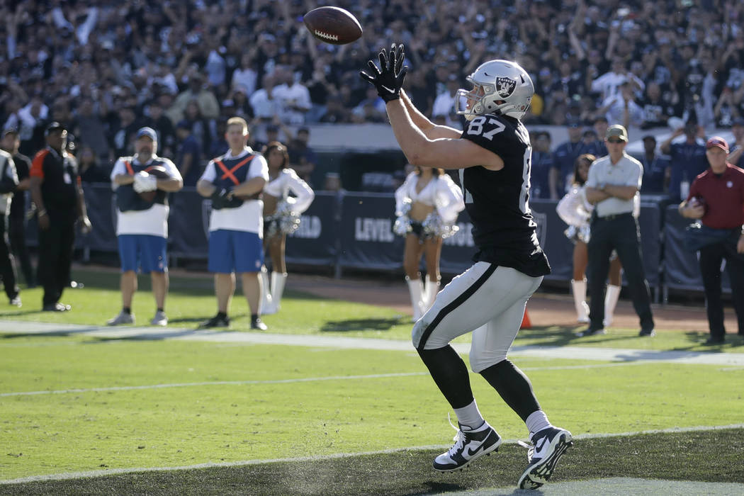 Oakland Raiders tight end Foster Moreau catches the ball for a touchdown during the first half ...