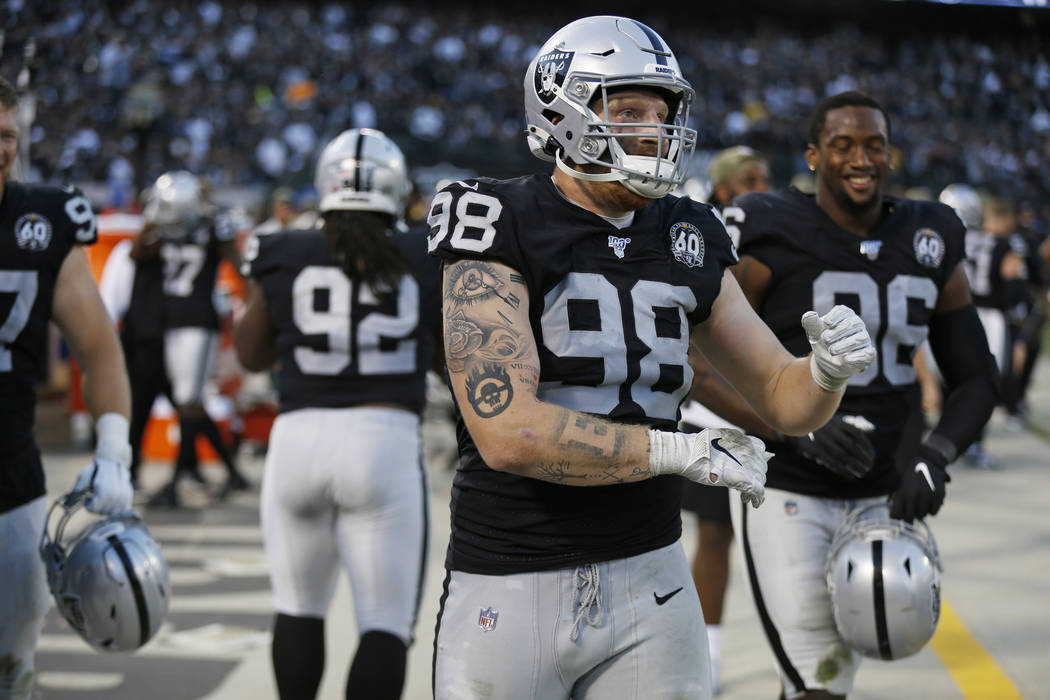 Oakland Raiders defensive end Maxx Crosby (98) on the bench during the second half of an NFL fo ...