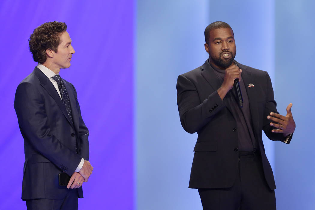 Rapper Kanye West, right, answers questions from Joel Osteen, left, during a service at Lakewoo ...