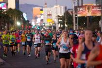 Runners make their way south on the Strip for the Rock 'n' Roll Marathon in Las Vegas, Sunday, ...