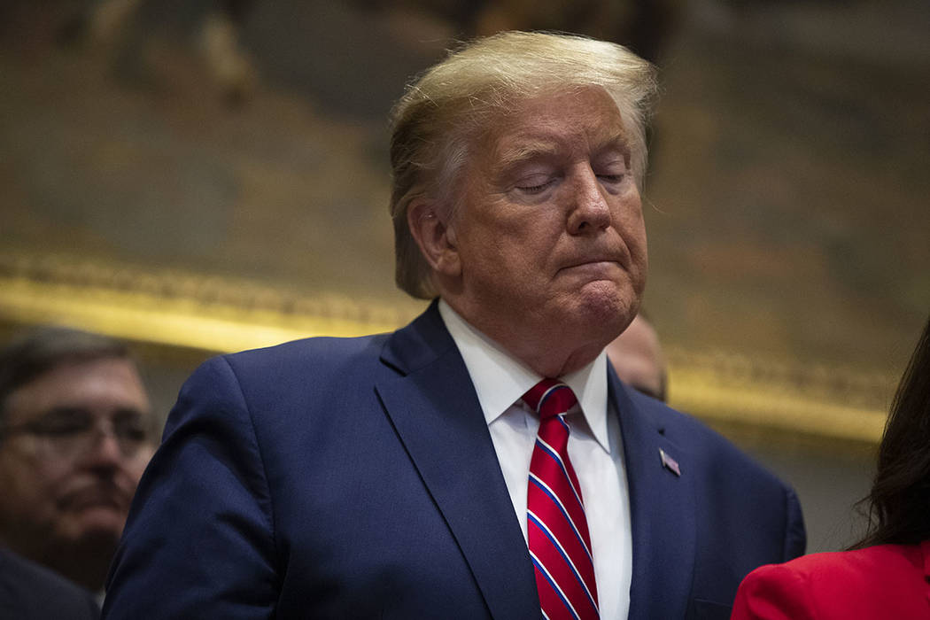 President Donald Trump pauses during an event on healthcare prices in the Roosevelt Room of the ...