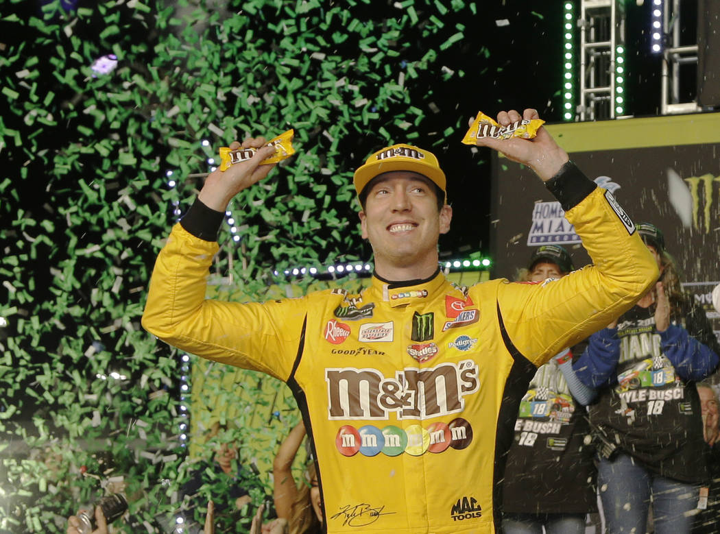 Kyle Busch celebrates in Victory Lane after winning a NASCAR Cup Series auto racing season cham ...