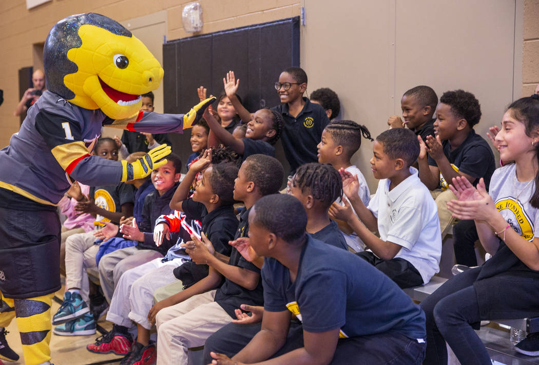 Chance the Gila monster greets kids at the Doc Pearson Community Center as Vegas Golden Knights ...