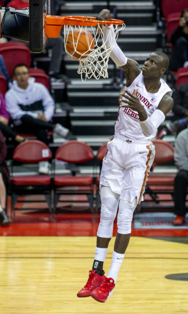 UNLV Rebels forward Mbacke Diong (34) dunks the ball over the Abilene Christian Wildcats defens ...