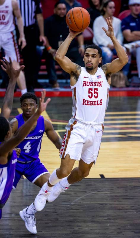 UNLV Rebels guard Elijah Mitrou-Long (55) gets off a pass over the Abilene Christian Wildcats d ...