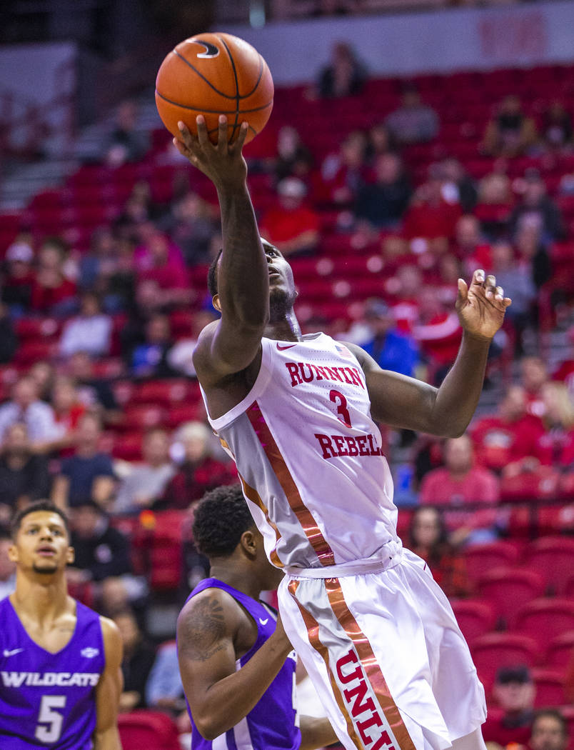 UNLV Rebels guard Amauri Hardy (3) drives the lane for a lay up versus the Abilene Christian Wi ...