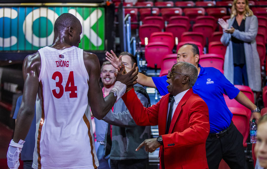 UNLV Rebels forward Mbacke Diong (34) is congratulated by security staff and fans after the win ...