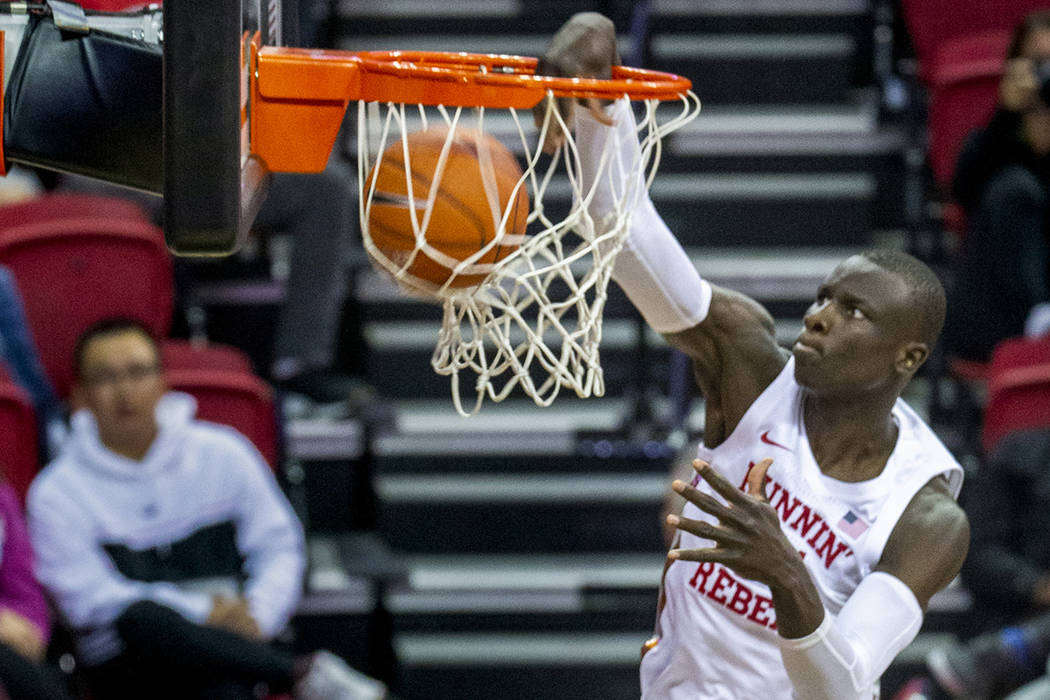 UNLV Rebels forward Mbacke Diong (34) dunks the ball over the Abilene Christian Wildcats defens ...