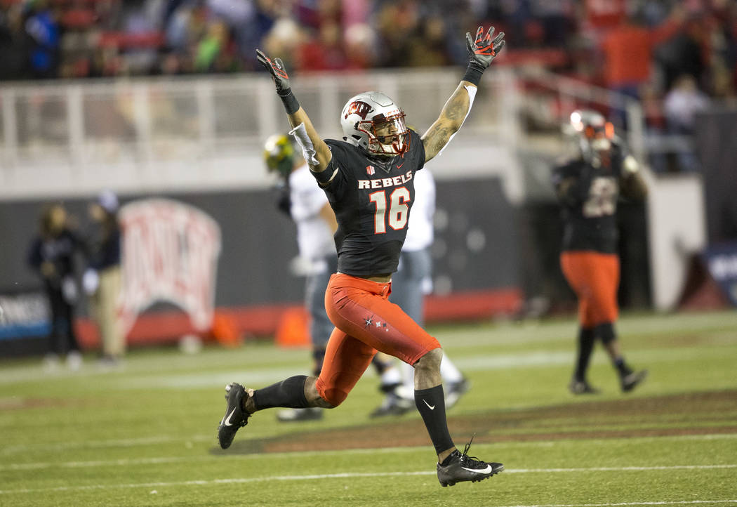 UNLV Rebels linebacker Javin White (16) celebrates his interceptions against the UNR Wolf Pack ...