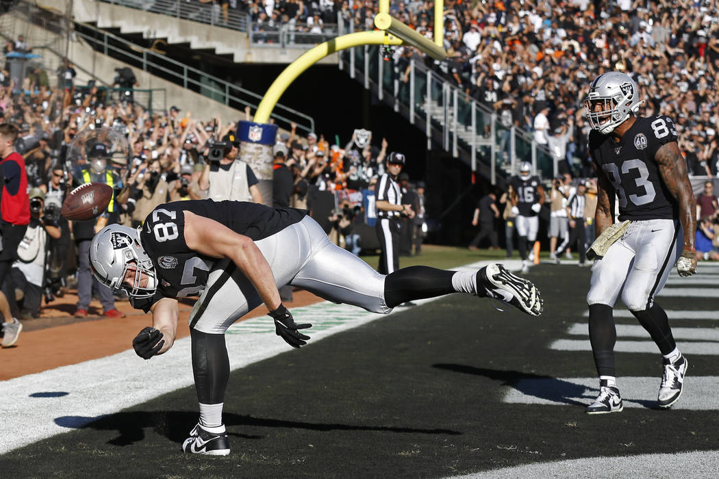 Oakland Raiders tight end Foster Moreau (87) celebrates after scoring a touchdown as tight end ...