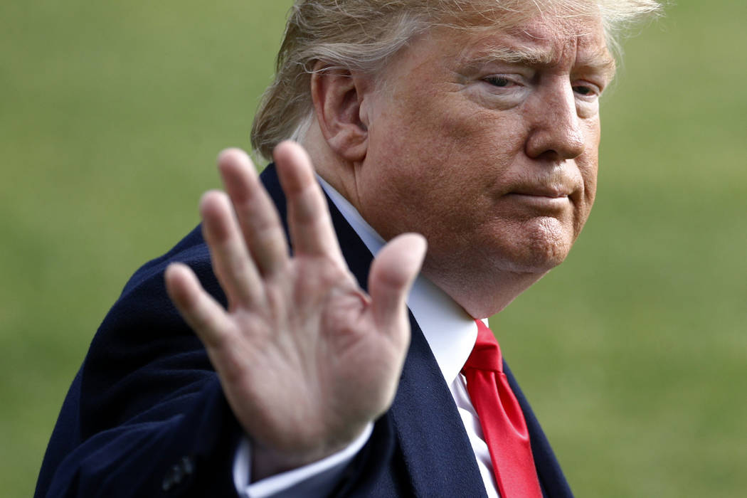 President Donald Trump walks to the Marine One helicopter after speaking to the media, Wednesda ...