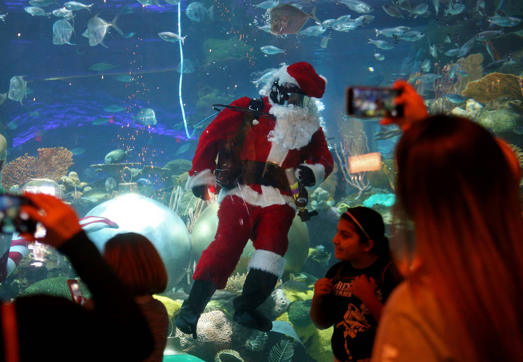 Underwater Santa greets the crowd at Silverton hotel and casino in Las Vegas, Sunday, Dec. 2, 2 ...