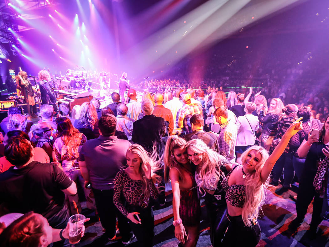 The onstage crowd on the VIP section for Aerosmith's "Deuces Are Wild" production are shown on ...
