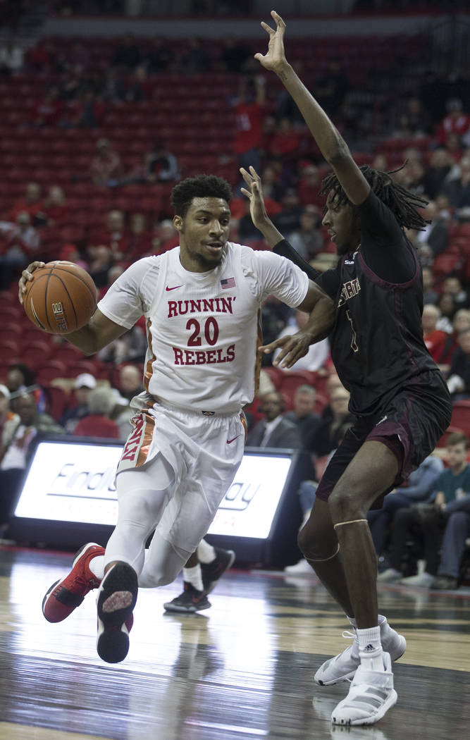 UNLV Rebels forward Nick Blair (20) jump steps on the way to the rim past Texas State Bobcats f ...