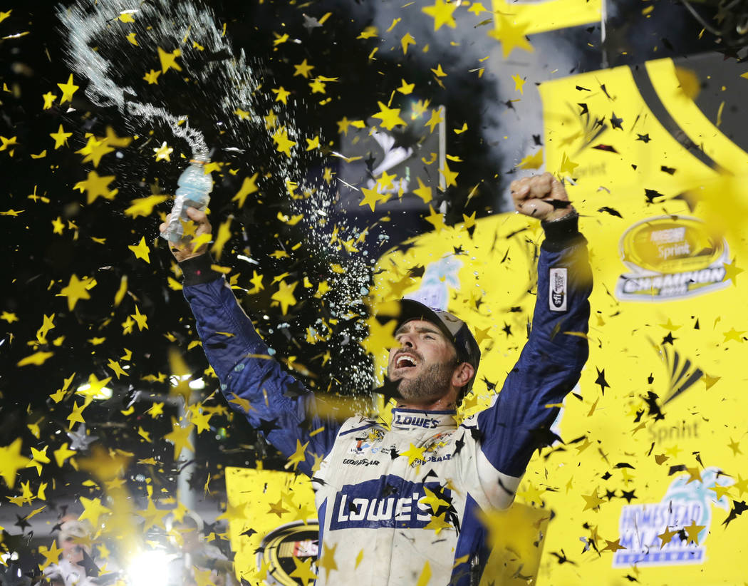 FILE - In this Nov. 20, 2016, file photo, Jimmie Johnson celebrates his NASCAR Sprint Cup auto ...