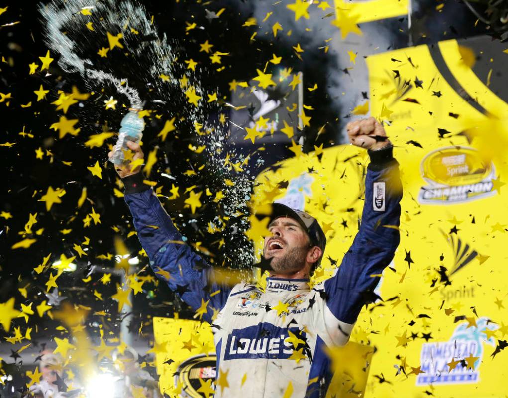 FILE - In this Nov. 20, 2016, file photo, Jimmie Johnson celebrates his NASCAR Sprint Cup auto ...