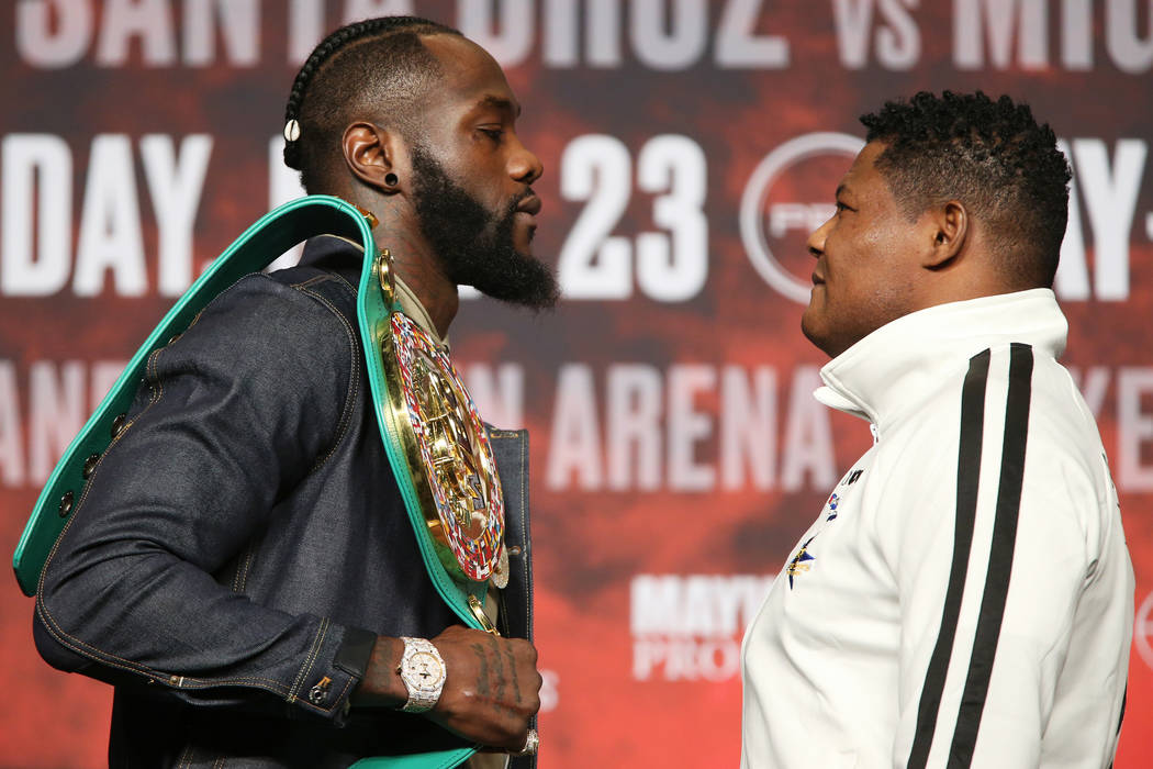 Deontay Wilder, left, and Luis Ortiz, pose during a press conference at the MGM Grand Garden Ar ...