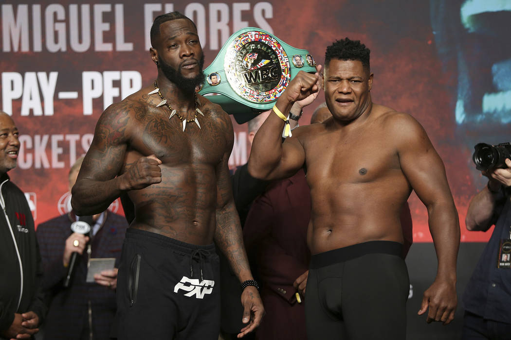 Deontay Wilder, left, and Luis Ortiz, pose during a weigh-in at the MGM Grand Garden Arena in L ...