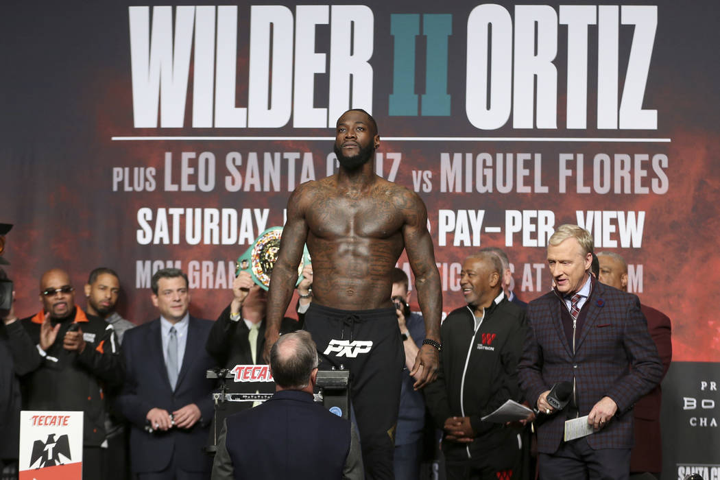 Deontay Wilder stands on the scale during a weigh-in at the MGM Grand Garden Arena in Las Vegas ...