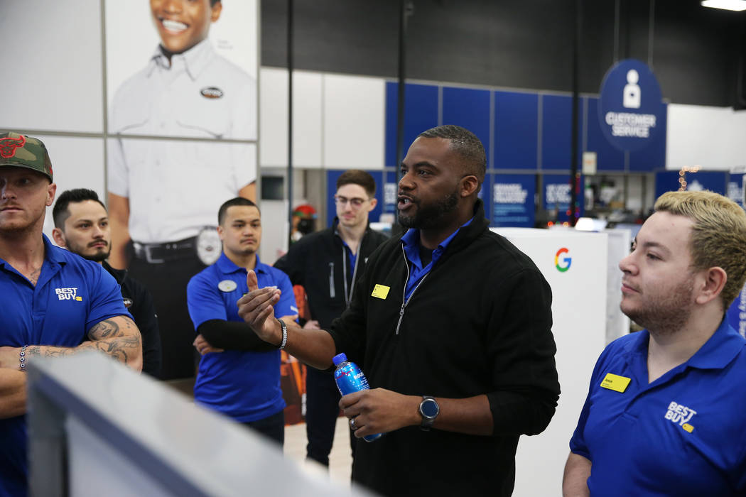 Computer supervisor T.J. Beverly leads employees during a training in preparation of Black Frid ...