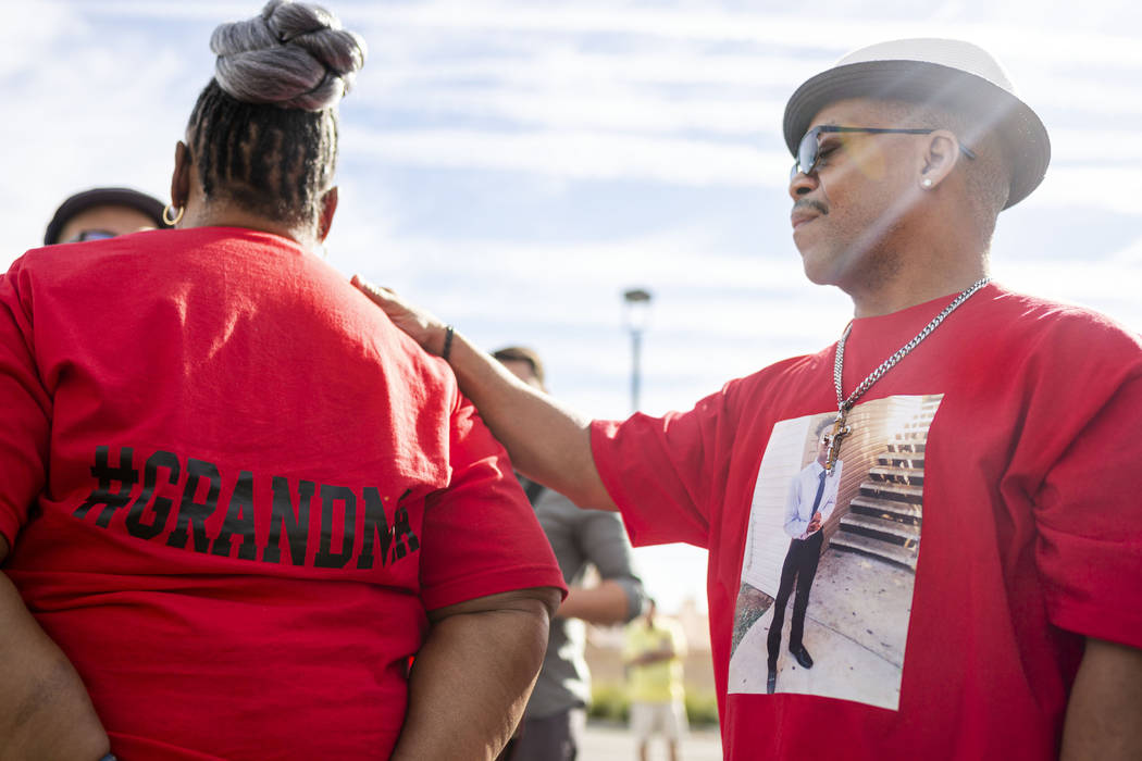 Sheilah Johnson, left, grandmother of homicide victim Jaejuan Williams, is comforted by husband ...