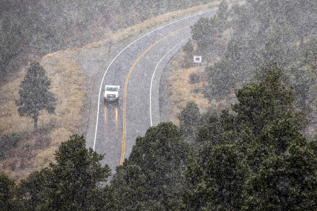 Snow falls along state Route 157 on Mount Charleston on Wednesday, Nov. 20, 2019. Lee Canyon re ...