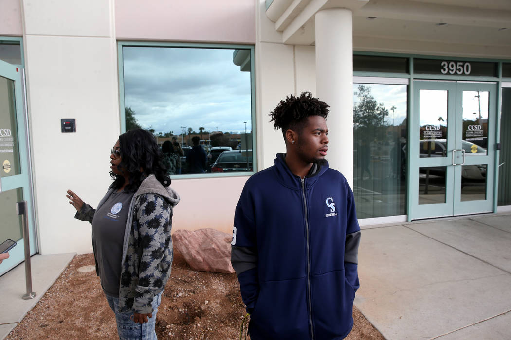 Canyon Springs quarterback DJ Lewis-Bealer and his mother Shalicia Lewis talk to a reporter out ...