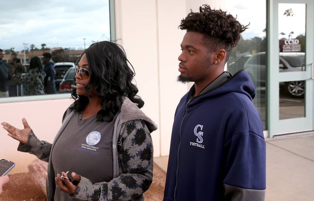 Canyon Springs quarterback DJ Lewis-Bealer and his mother Shalicia Lewis talk to a reporter out ...